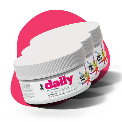 Angled view of three Five Daily Buzz gummy jars showing large daily label and 5 mg THC + 25 mg CBD callout on pink background